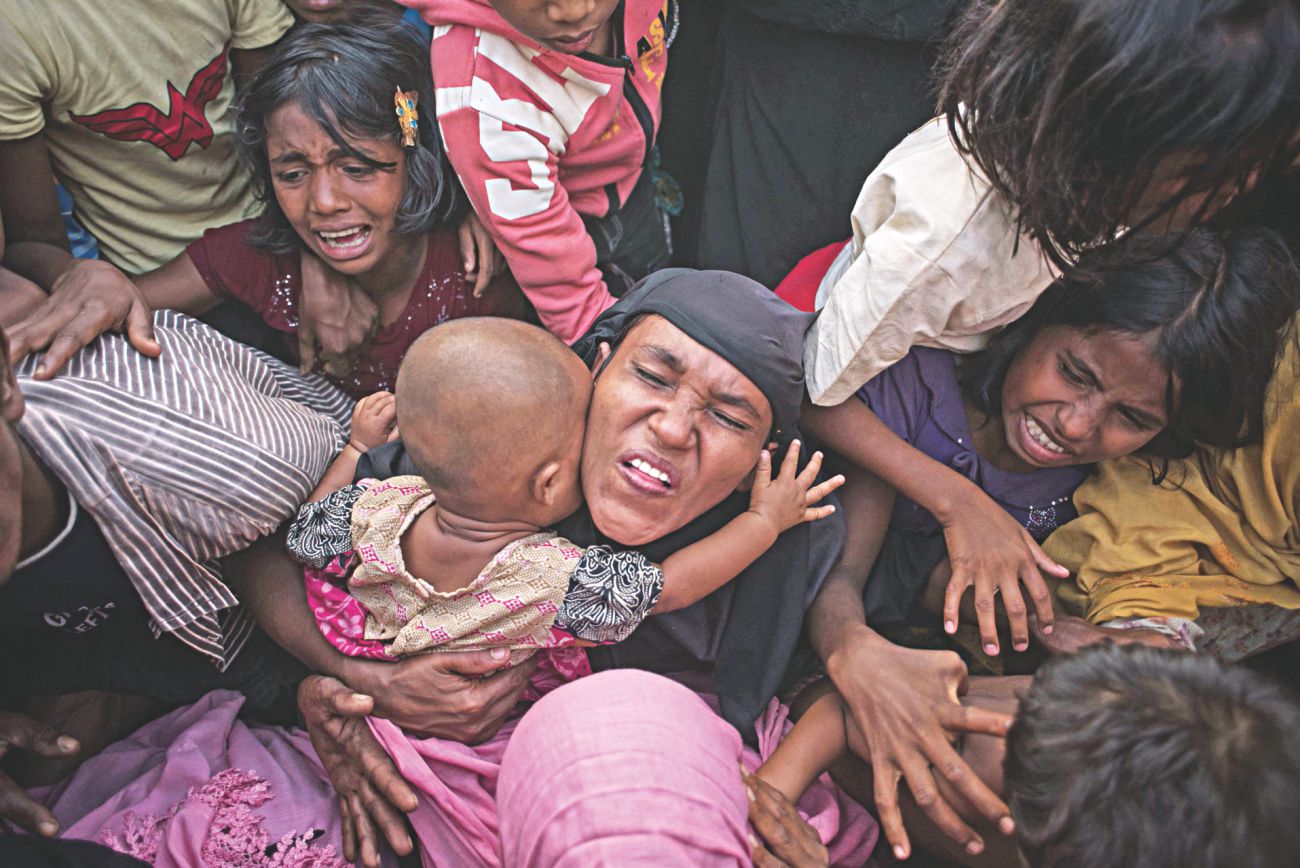 Rohingya refugees react.jpg