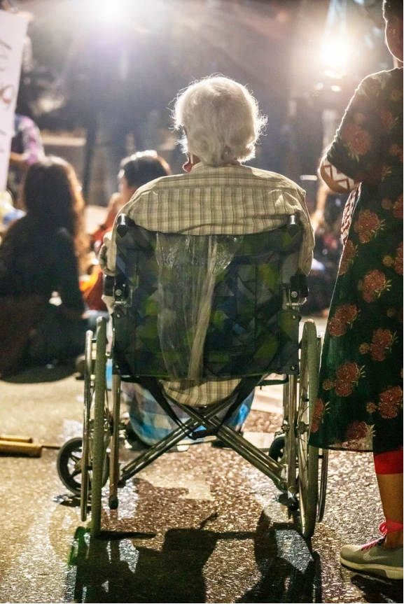A wheelchair-bound Zafrullah Chowdhury joins a protest rally against rape.
