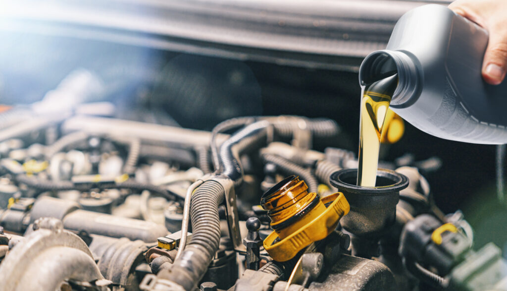 pouring_oil_to_car_engine.jpg