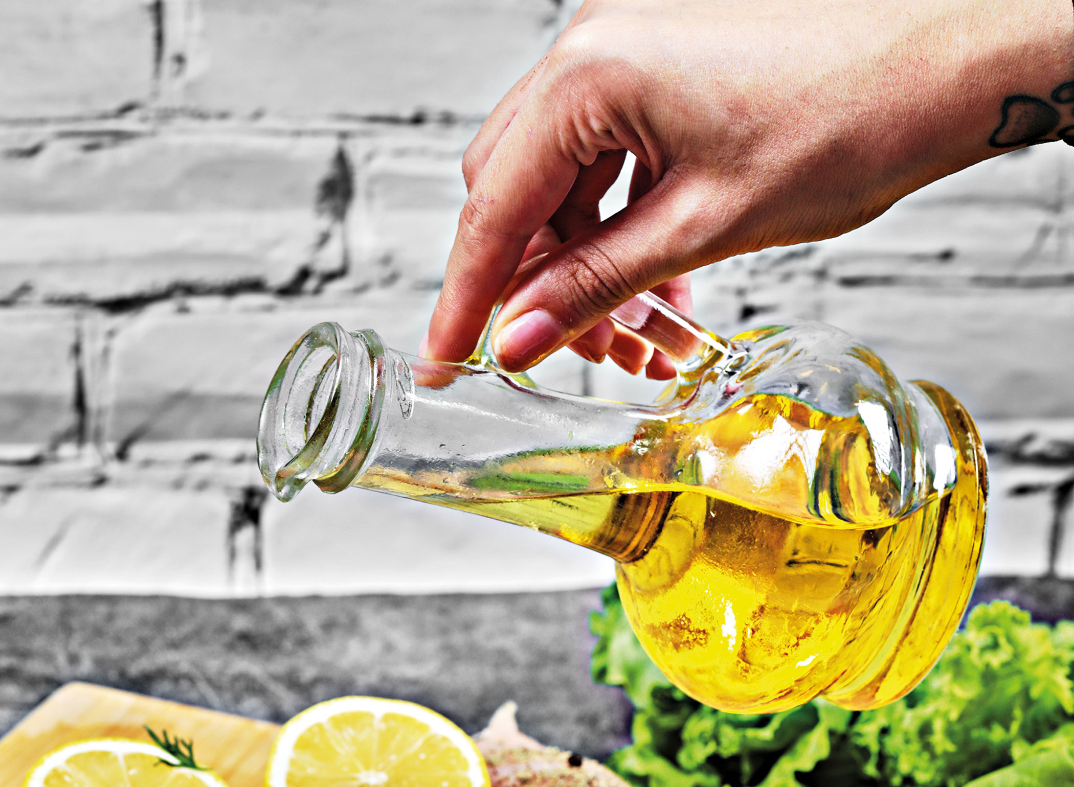 hand-pours-oil-plate.jpg