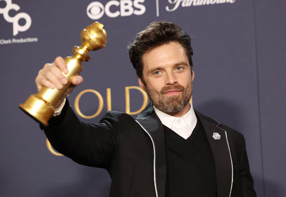 Sebastian Stan poses with the award for Best Performance by an Actor in a Motion Picture — Musical or Comedy for "A Different Man" at the 82nd Golden Globe Awards in Beverly Hills, California.jpg