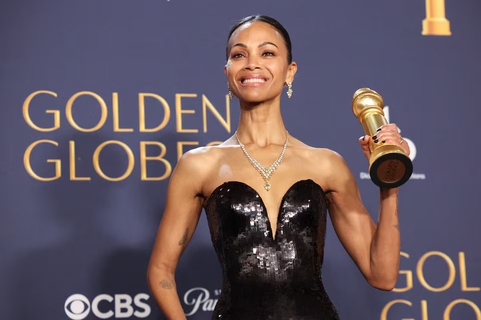 Zoe Saldana poses with the Best Performance by a Female Actor in a Supporting Role in An Motion Picture Award for "Emilia Perez," at the 82nd Golden Globe Awards.jpg