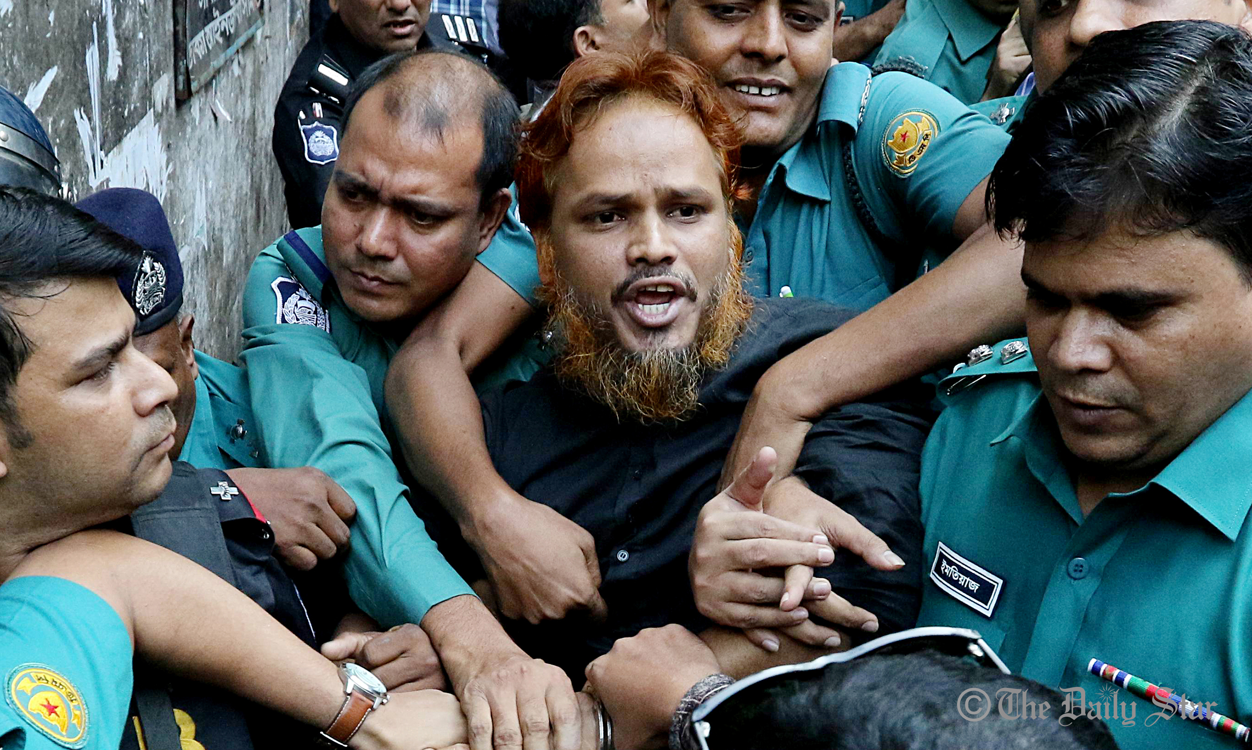 a_convict_in_the_holey_artisan_cafe_attack_case_is_being_taken_to_the_prison_van_amid_high_security._photo-anisur_rahman_star.jpg