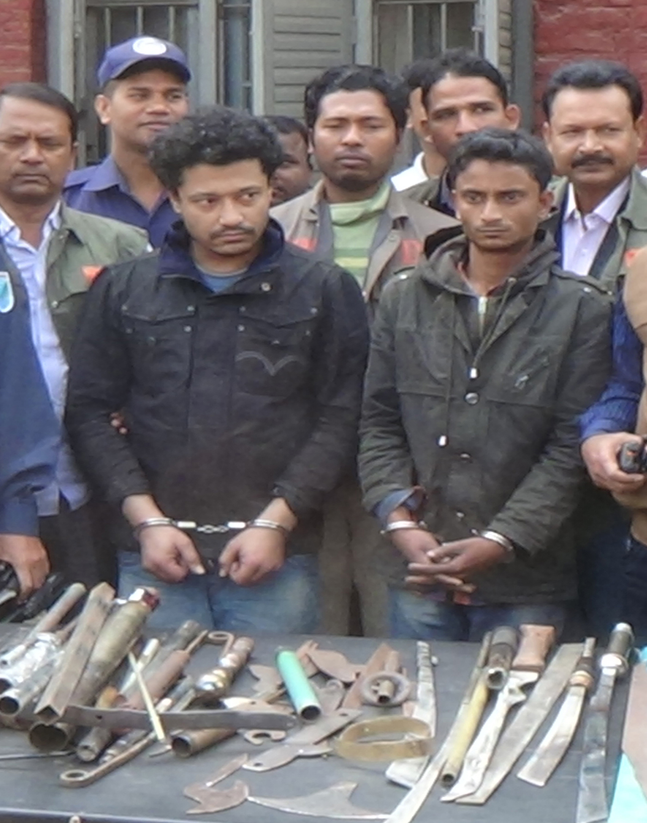 Mymensingh-2-held-with-arms.jpg
