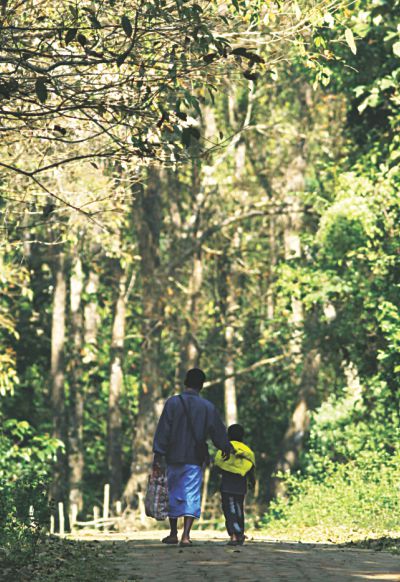 Father and son walk home from school