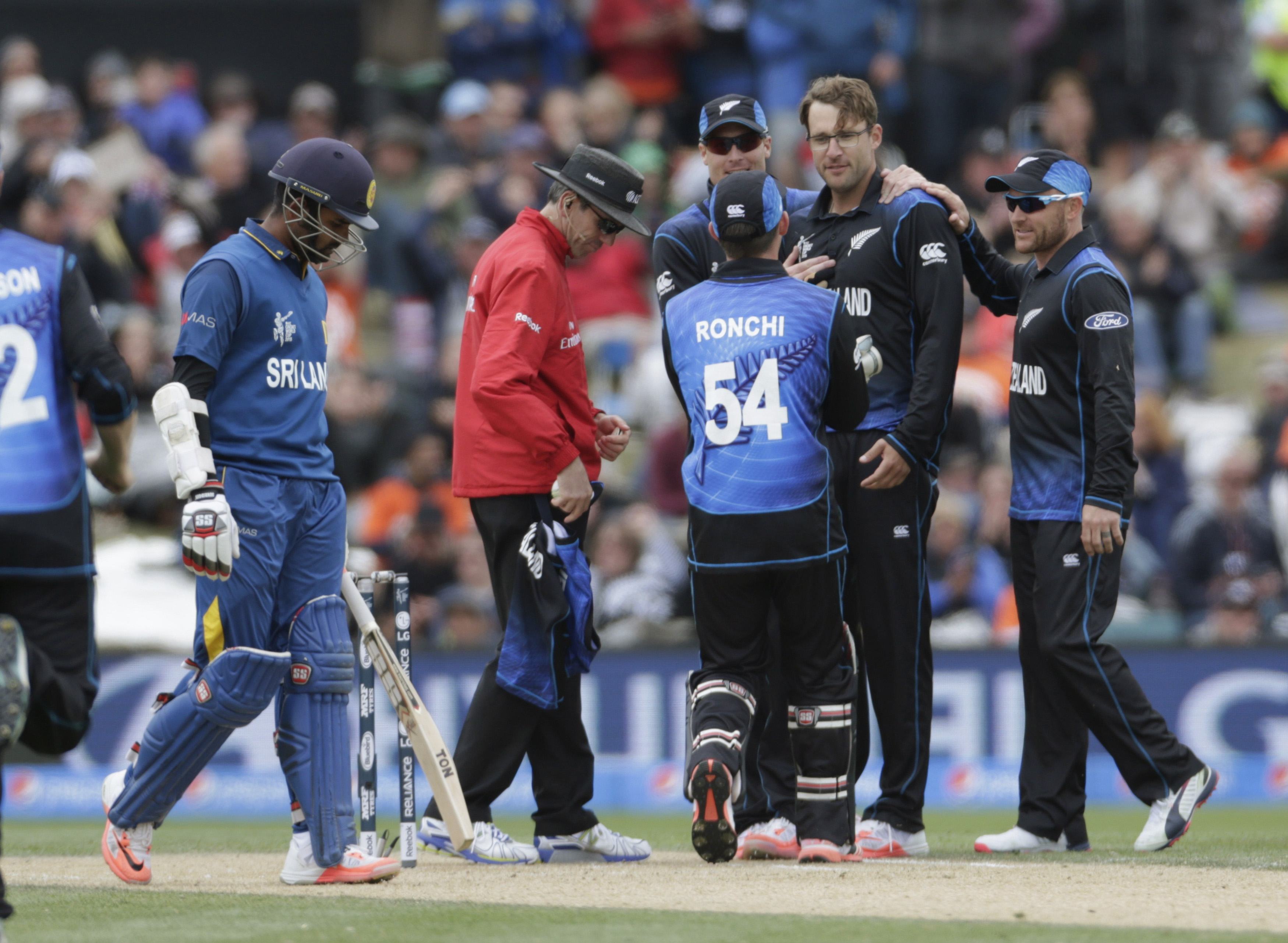 Teammates celebrate with Vettori.JPG