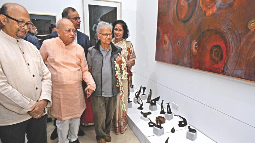 Sculptor Hamiduzzaman Khan and other guests at the exhibition