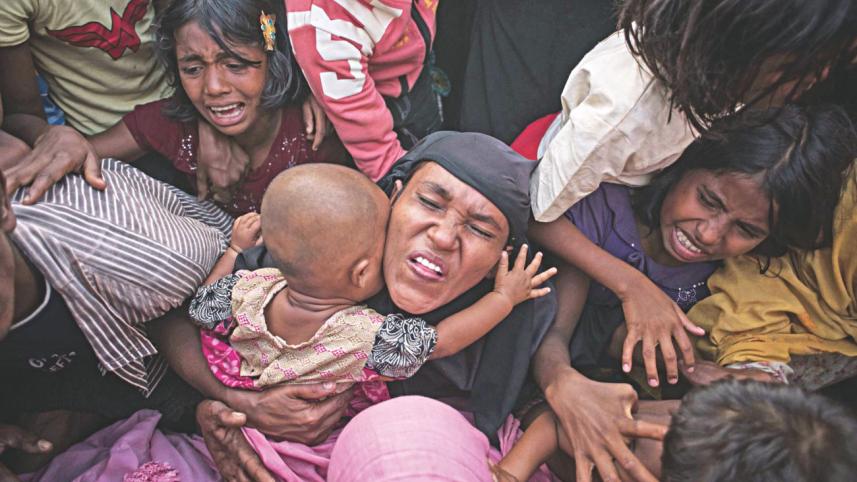 Rohingya refugees react.jpg