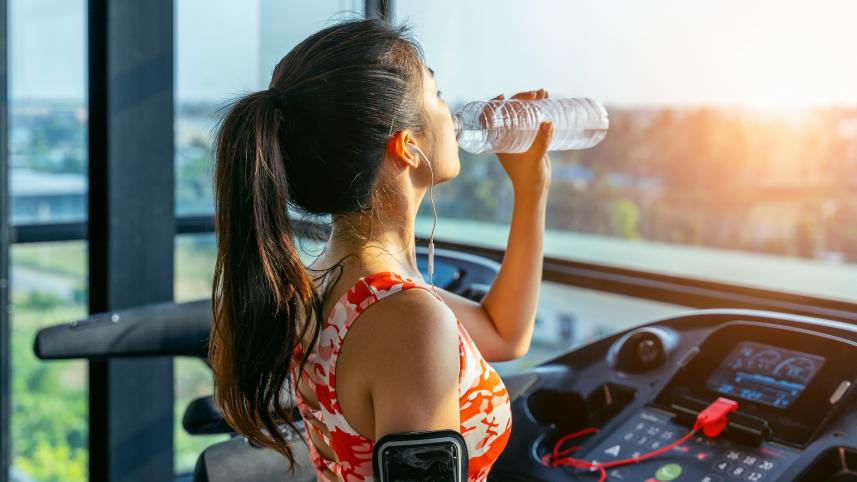 young-woman-drinking-water-gym-exercise-concept.jpg