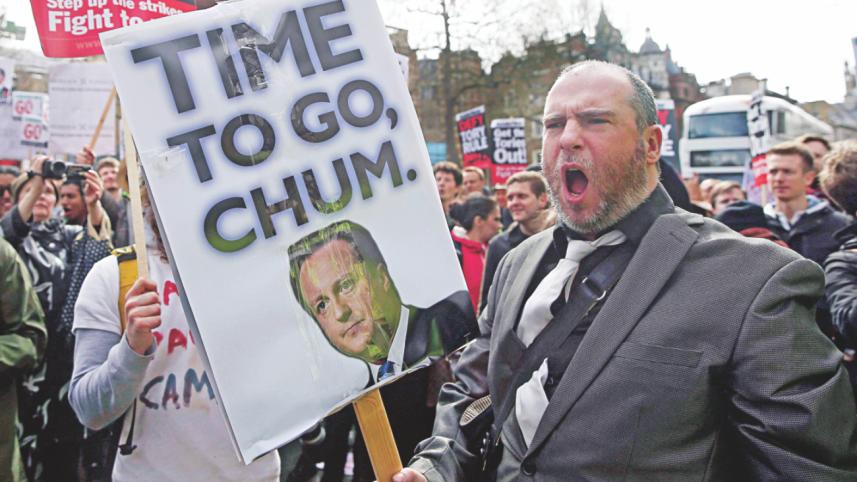 Demonstrators hold placards 2.jpg