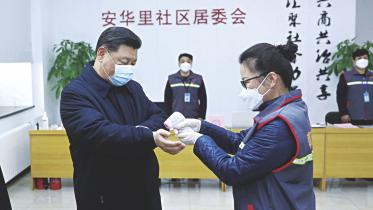 health worker checks Chinese President Xi Jinping.jpg
