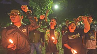 Indonesians takes part candlelight vigil.jpg