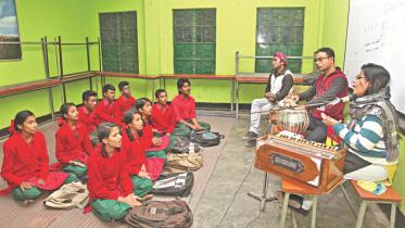 Students learn music at Surer Dhara