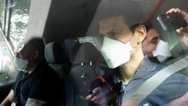 novak_with_mask.jpg