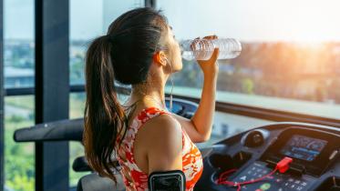 young-woman-drinking-water-gym-exercise-concept.jpg