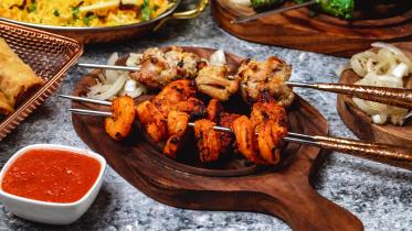 side-view-lamb-kebab-with-shrimps-griled-onion-sauce-board.jpg