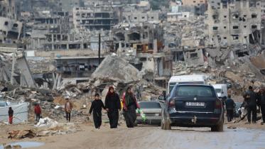 displaced_palestinians_walk.jpg