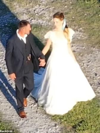 90164011-13897311-the_newlyweds_looked_happy_in_love_as_the_headed_to_their_recept-a-122_1727409974928.jpg